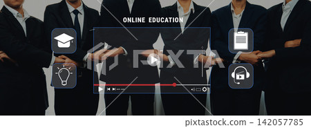 Professional group in business attire presenting online education concept with video, icons, and symbols for learning, training, and communication strategies Trope Professional group in business attire presenting online education concept with video, icons, and symbols for learning, training, and communication strategies Trope 142057785
