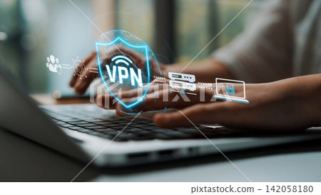 A person using a laptop with a virtual private network graphic overlay, highlighting the importance of internet security and data privacy in today digital world. Sigmoid A person using a laptop with a virtual private network graphic overlay, highlighting the importance of internet security and data privacy in today digital world. Sigmoid 142058180