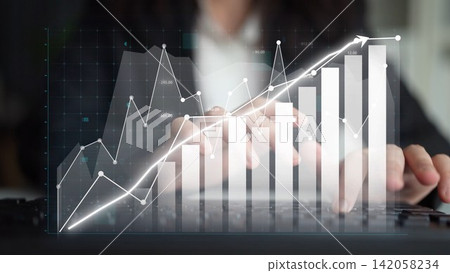 Business Professional Analyzing Growth Trends with Graphs and Charts on a Laptop in a Modern Office Environment for Financial Success Copula Business Professional Analyzing Growth Trends with Graphs and Charts on a Laptop in a Modern Office Environment for Financial Success Copula 142058234
