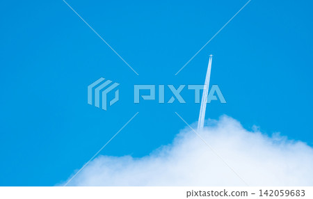 Airplane with white condensation tracks. Jet plane on blue sky and white clouds with vapor trail. Travel by airplane concept. Trails of exhaust gas from airplane engine. Aircraft with white stripes. Airplane with white condensation tracks. Jet plane on blue sky and white clouds with vapor trail. Travel by airplane concept. Trails of exhaust gas from airplane engine. Aircraft with white stripes. 142059683