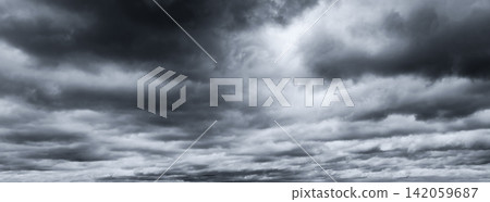 Dark dramatic sky and clouds. Background for death and sad concept. Gray sky and fluffy white clouds. Thunder and storm sky. Sad and moody sky. Nature background. Dead abstract background. Cloudscape. Dark dramatic sky and clouds. Background for death and sad concept. Gray sky and fluffy white clouds. Thunder and storm sky. Sad and moody sky. Nature background. Dead abstract background. Cloudscape. 142059687