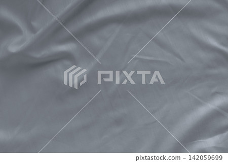 Closeup of white linen bed sheet texture with natural wrinkles. Premium hotel bedding, comfortable sleep environment, luxury bedroom interior, clean fabric background and household comfort. 142059699