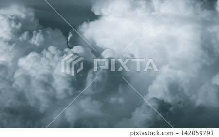 Detailed cumulonimbus storm cloud texture filling the frame with dramatic atmospheric formations, powerful weather conditions and natural cloudscape background for climate concepts. Detailed cumulonimbus storm cloud texture filling the frame with dramatic atmospheric formations, powerful weather conditions and natural cloudscape background for climate concepts. 142059791