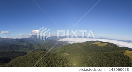 Aerial view of Carpathian mountains in Ukraine with valleys and forests Aerial view of Carpathian mountains in Ukraine with valleys and forests 142060028