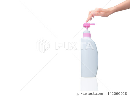 Woman hand pressed on pump cosmetic bottle isolated on white. Shampoo or hair conditioner plastic bottle and dispenser pump. Body soap or shower gel packaging. Liquid soap bottle. Body lotion bottle. 142060928