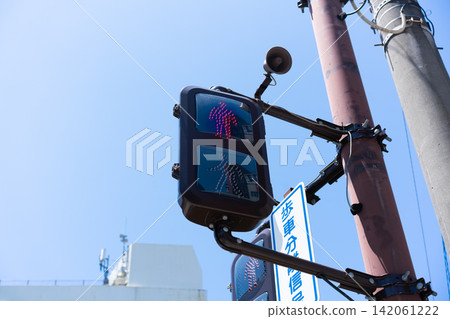 Low angle view of Japanese pedestrian traffic signal showing red light with copy space in Fukuoka, Japan Low angle view of Japanese pedestrian traffic signal showing red light with copy space in Fukuoka, Japan 142061222