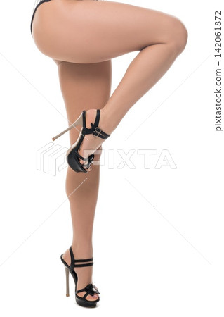 Elegant high heel footwear, showcasing stylish black heels and leg posture Elegant high heel footwear, showcasing stylish black heels and leg posture 142061872