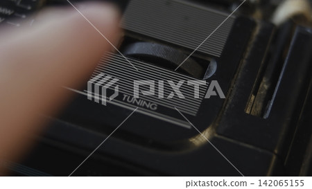 Detailed View Of Antique Radio Tuning Knob Emphasizing Ribbed And Intricate Textural Features . Media Detailed View Of Antique Radio Tuning Knob Emphasizing Ribbed And Intricate Textural Features . Media 142065155
