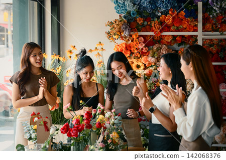 Candid Photo series Women celebrating and applauding together after completing a workshop Candid Photo series Women celebrating and applauding together after completing a workshop 142068376