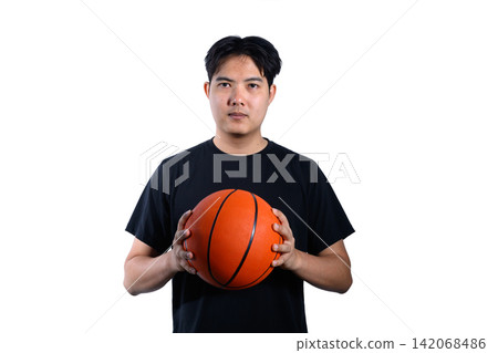 Young Asian Man Holding Basketball on White Isolated Background in Black T Shirt Young Asian Man Holding Basketball on White Isolated Background in Black T Shirt 142068486