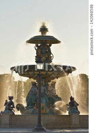 The fountain in Place de la Concorde, gleaming in the evening sunlight. Paris, France (August 11, 2026) The fountain in Place de la Concorde, gleaming in the evening sunlight. Paris, France (August 11, 2026) 142068586