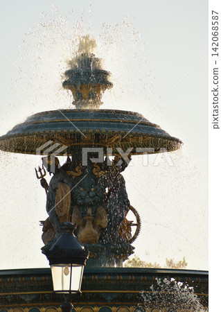 The fountain in Place de la Concorde, gleaming in the evening sunlight. Paris, France (August 11, 2026) The fountain in Place de la Concorde, gleaming in the evening sunlight. Paris, France (August 11, 2026) 142068587