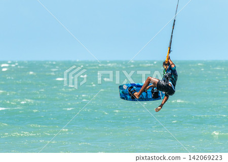 Barra Grande, Brazil - Jan 22, 2026: Kite surfing at Barra Grande beach on the coast of Piaui, northeastern Brazil. Barra Grande, Brazil - Jan 22, 2026: Kite surfing at Barra Grande beach on the coast of Piaui, northeastern Brazil. 142069223