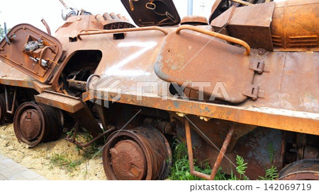 Rusty and burned-out armored vehicles on ukrainian territory. Exhibition of destroyed military equipment of the russian army. War between Ukraine and russia. Close up Slow motion Rusty and burned-out armored vehicles on ukrainian territory. Exhibition of destroyed military equipment of the russian army. War between Ukraine and russia. Close up Slow motion 142069719