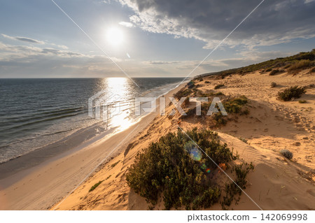 Golden Sunset Over Matalascanas Beach with Horse Rider, Almonte, Huelva, Spain Golden Sunset Over Matalascanas Beach with Horse Rider, Almonte, Huelva, Spain 142069998