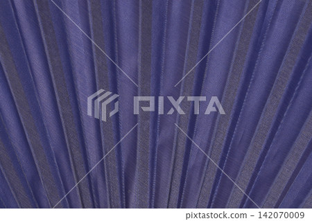Dark blue pleated fabric of a folding hand fan close up Dark blue pleated fabric of a folding hand fan close up 142070009