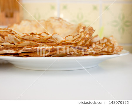 Pancakes lying on a plate. Pancakes lying on a plate. 142070555