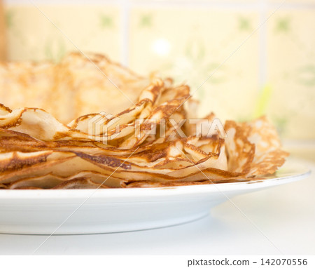 Pancakes lying on a plate. Pancakes lying on a plate. 142070556