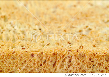 narrow focusing macro shot of the edge of a crunchy golden toasted sliced sliced whole sandwich bread for food wallpaper background narrow focusing macro shot of the edge of a crunchy golden toasted sliced sliced whole sandwich bread for food wallpaper background 142071254