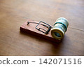 Hundred dollar bills caught in wooden mousetrap 142071516