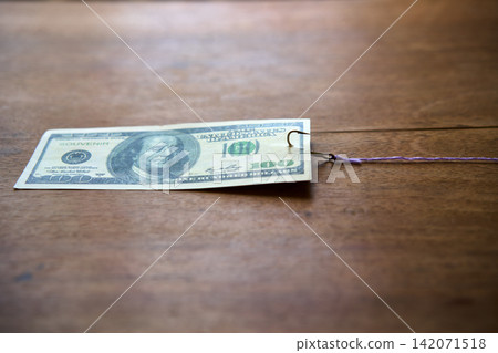 One hundred dollar bill on fishing hook One hundred dollar bill on fishing hook 142071518