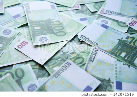 Money background of scattered one hundred euro bills Money background of scattered one hundred euro bills 142071519