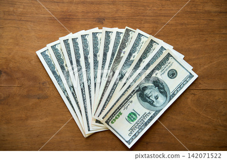 Fanned hundred dollar bills Fanned hundred dollar bills 142071522