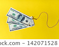 Dollars on fishing hook financial scam background 142071528