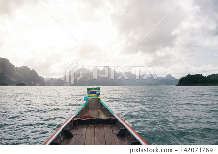 traveling by boat floated on water to go to somewhere in sunshine 142071769