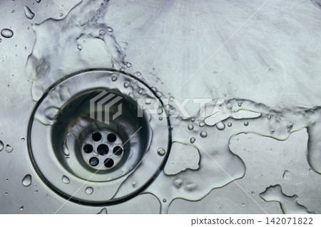 a wet dirty sink after washing many dishes photo may had noise and gain 142071822