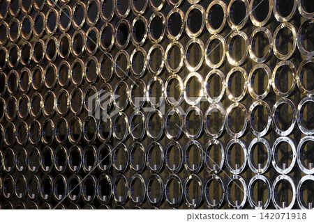 structure of many steel rings that made to be a wall in the room of the building that can be use as background texture wallpaper structure of many steel rings that made to be a wall in the room of the building that can be use as background texture wallpaper 142071918