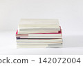 Stack of Textbooks Piled on White Background in Front View 142072004