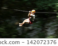 Exciting Ziplining Adventure Through Forest Canopy 142072376