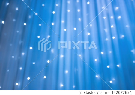 blurred focus of decorative lights in blue background 142072654