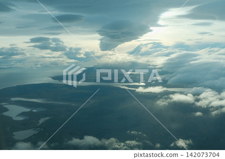Lakes and dramatic clouds viewed from above the area around Santiago Lakes and dramatic clouds viewed from above the area around Santiago 142073704
