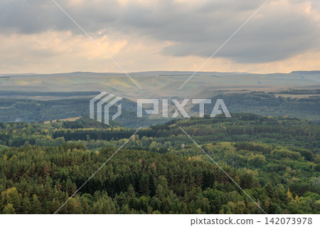Layers of green mountains and hills in the haze during sunset. Panoramic View of Green hills and Meadow. Layers of green mountains and hills in the haze during sunset. Panoramic View of Green hills and Meadow. 142073978