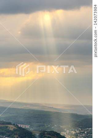 Layers of green mountains and hills in the haze during sunset. Panoramic View of Green hills and Meadow. Layers of green mountains and hills in the haze during sunset. Panoramic View of Green hills and Meadow. 142073984