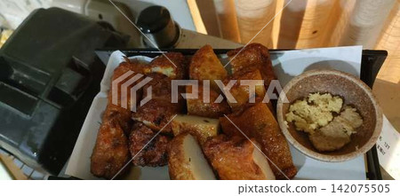 A dish of deep-fried satsuma-age (fish cake). A dish of deep-fried satsuma-age (fish cake). 142075505