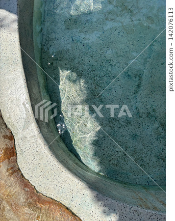 Natural mineral pool with clear thermal water Natural mineral pool with clear thermal water 142076113