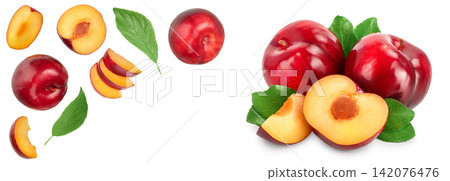fresh red plum and half with leaves isolated on white background with copy space for your text. Top view. Flat lay fresh red plum and half with leaves isolated on white background with copy space for your text. Top view. Flat lay 142076476