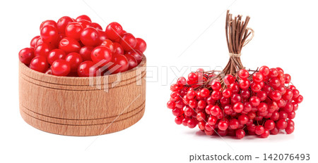 ripe red viburnum berries in a wooden bowl isolated on white background ripe red viburnum berries in a wooden bowl isolated on white background 142076493