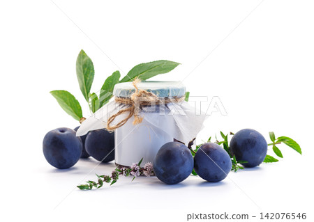 Homemade plum jam with ripe plums on clean white background 142076546