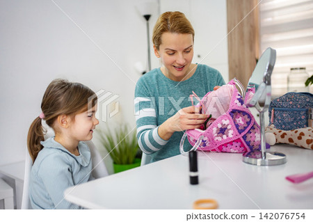 Mother and daughter sharing beauty routine moments at home Mother and daughter sharing beauty routine moments at home 142076754