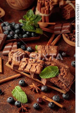 Brownie with blueberries and mint. Brownie with blueberries and mint. 142076827