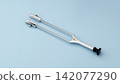 Otolaryngology Acoustic Tuning Fork C 128 on Blue Surface 142077290