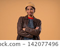 Stylish African Teenage Girl Smiling At Camera, Natural Beauty. Young lady, Kind Confident Smile 142077496