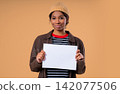 Smiling Pretty Teenage Girl Holding Horizontal Blank White A4 Paper Poster Toward Camera, Young 142077506