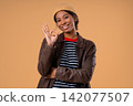 Positive African Teenager Girl Forms Ok, Okay, Smiling Confident. Confirmation satisfaction 142077507