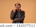 Breakthrough Genius Idea. Happy African Teen Girl Eureka Moment, Pointing Finger on beige background 142077511