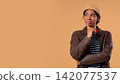 Thoughtful Around African Teen school student girl, Weighing Options. Puzzled Lady Looking Answer 142077537